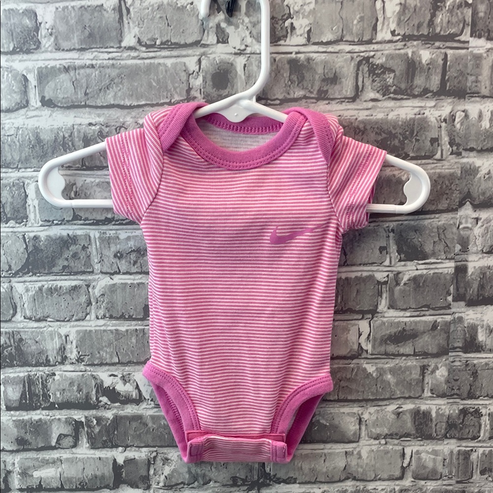 Nike Pink and White Striped Baby onesie